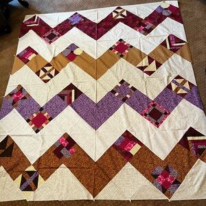 Patchwork Quilt Top with Purple, Pink, and Cream Accents
